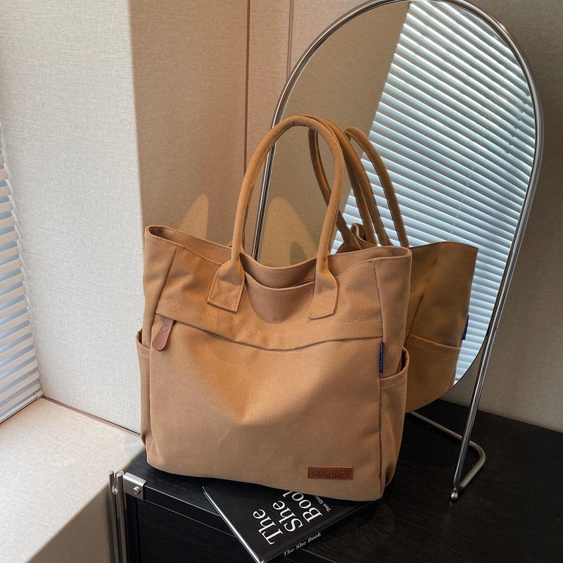 Casual large-capacity canvas bag women's new fashion commuter versatile shoulder bag college student tote bag