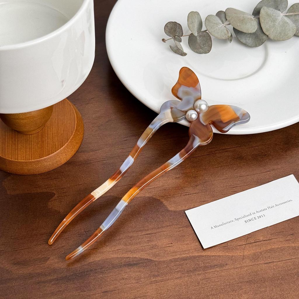 Elegant fjärilshårnål gjord av acetat med pärlinläggning Snygg U-formad hårpinne