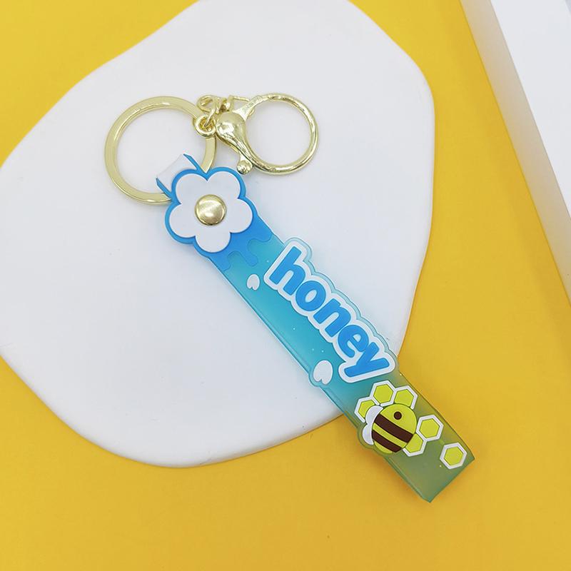Transparent Pvc Soft Rubber Rope Keychain English Small Flower Jelly Color Plum Blossom Candy Color Drop Adhesive Wristband