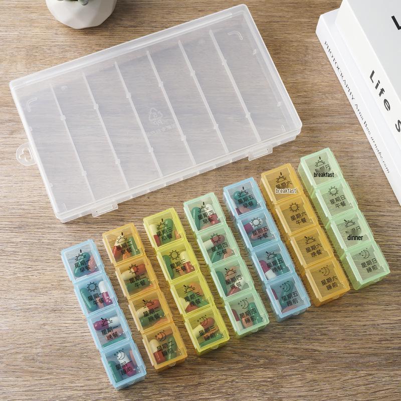 Starší 7denní 28přihrádkový přenosný organizér na pilulky s rozdělovačem