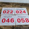 Red Running Marathon Race Bib with Black Number Plate