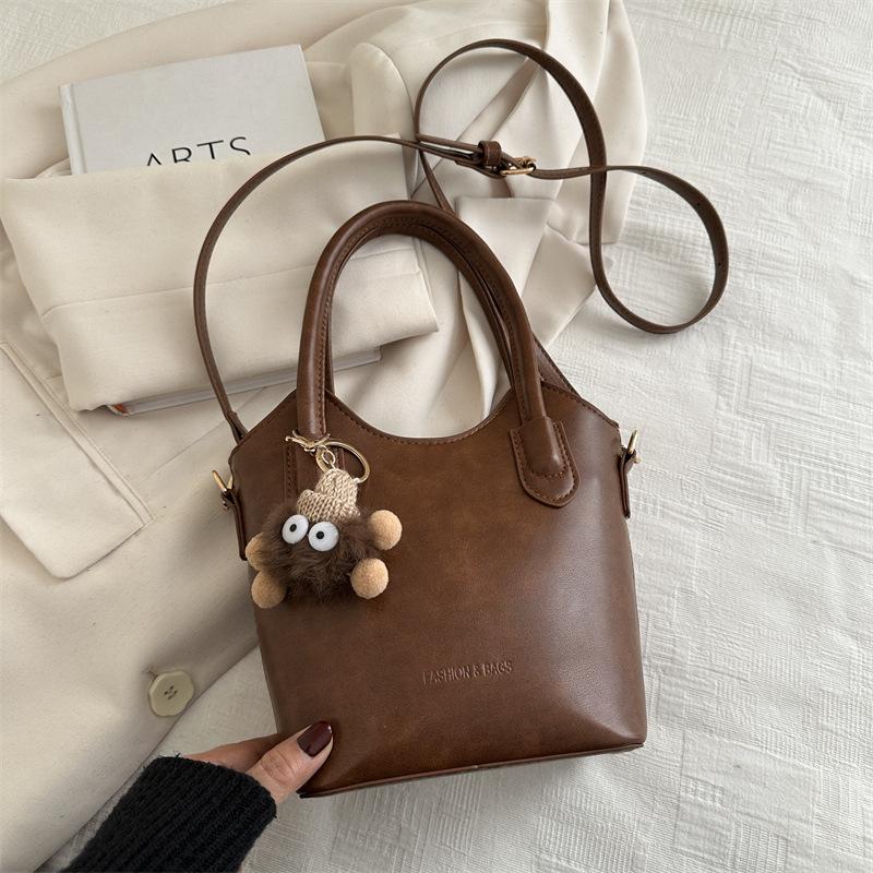 

2025 зима новая высокоценная темпераментная деловая портативная женская сумка легкая роскошь персонализированная модная на плечо кроссбоди сумка-ведро Without pendant коричневый
