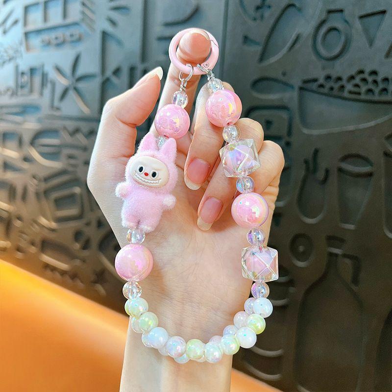 

Creative flocking modified doll cloth double line bead phone chain keychain cute bag car pendant розовый