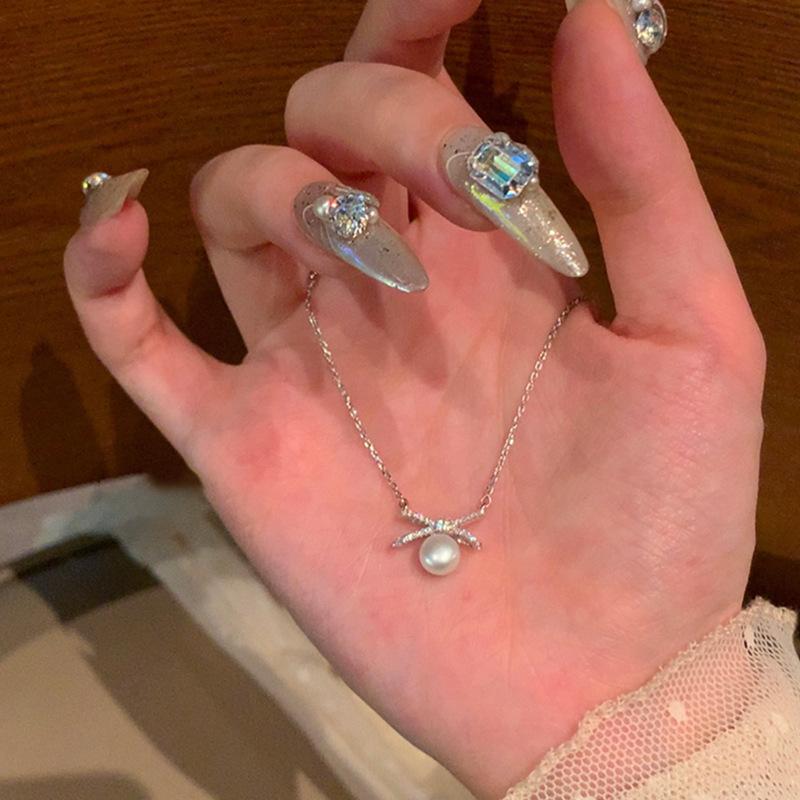 

Нишевый дизайн Sense Bow Жемчужное ожерелье Женская простота Высокая индивидуальность Мода Темперамент Универсальная цепочка на шею Цепочка на ключицу