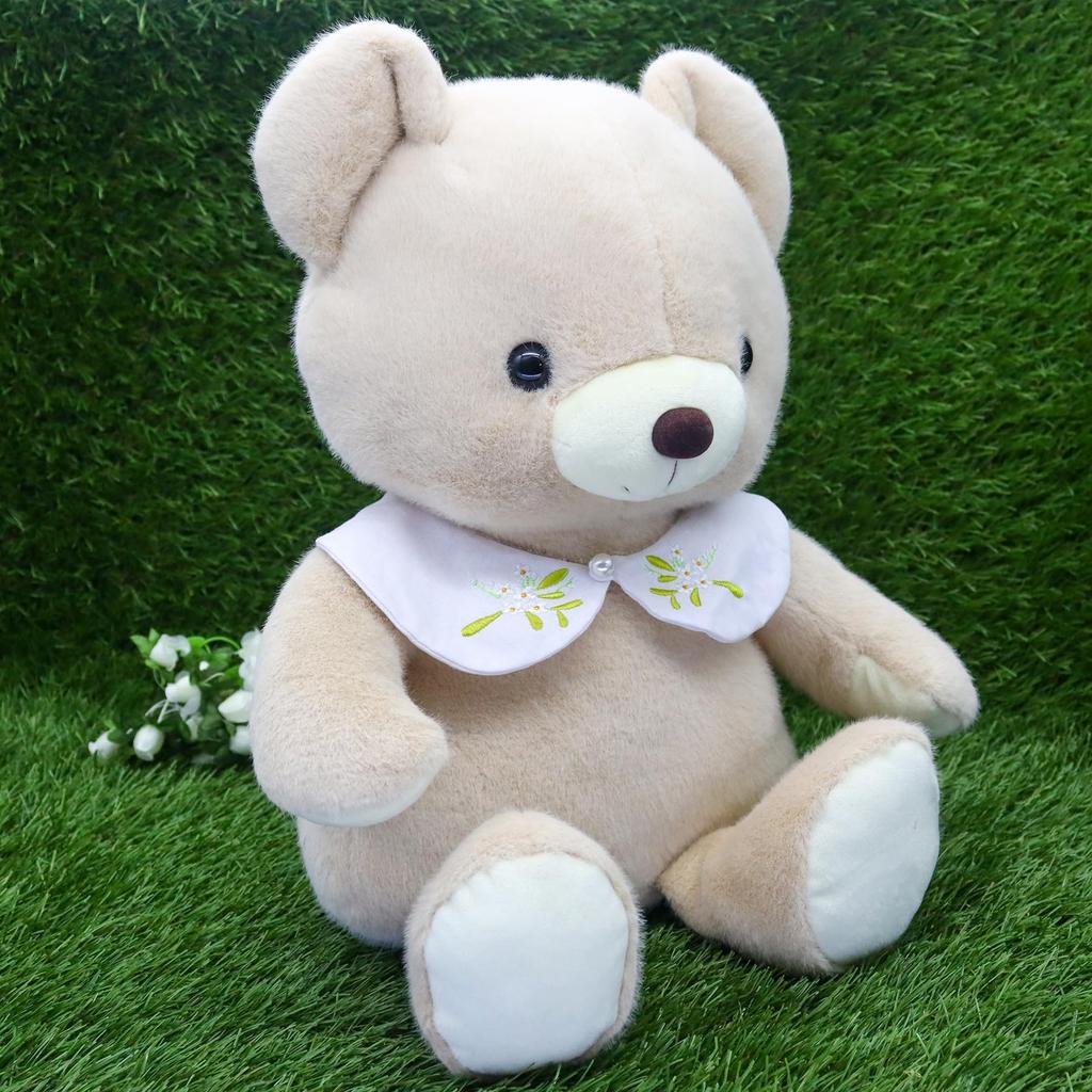 Take Off Bear Cub a retro bear with a cute floral embroidery on the beige plush toy with music Drop, pastel-colored collar. Large, box.
