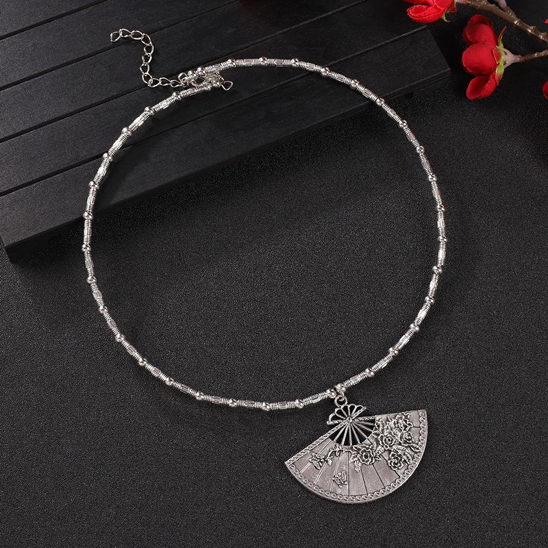 Vintage tassel collar hollow flower seedling silver pendant necklace niche personality collarbone chain women