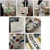 Large Capacity Stylish Canvas Tote Bag With Vibrant Letter Print Design For Everyday Use
