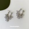 Silver zircon fringed earclips, holeless high-end mosquito coil disc earrings, temperament studs, niche unique earrings.