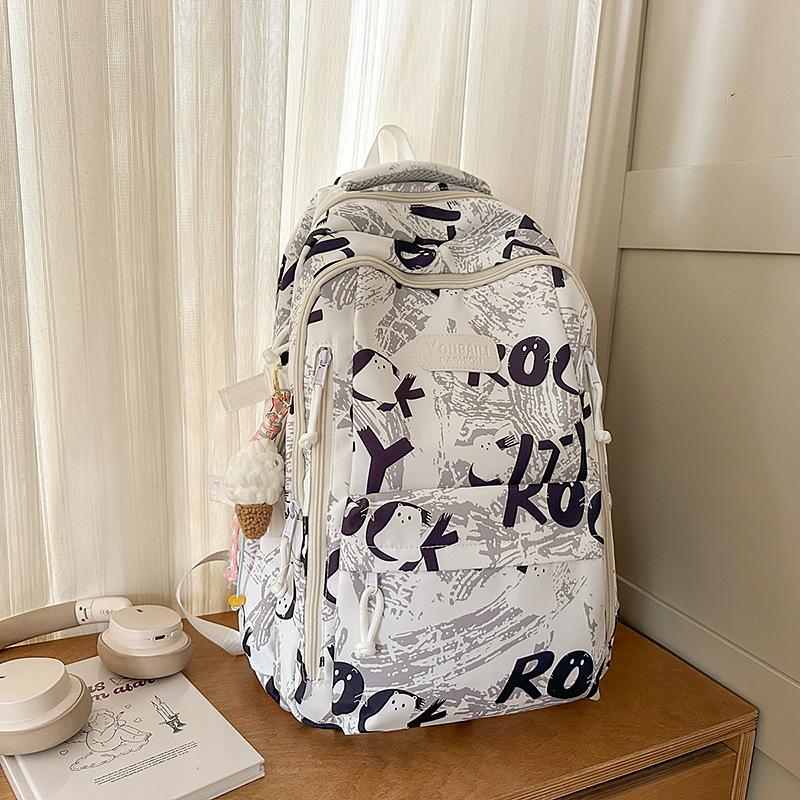 Backpack female junior high school college students high value new large capacity graffiti design sense backpack female