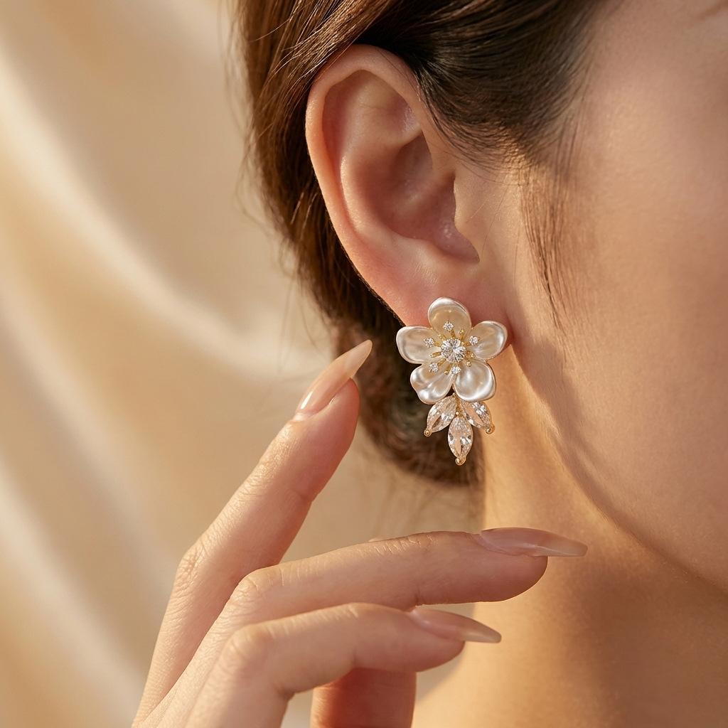Light Luxury Mother-of-Pearl Flower Earrings for Women 9 Silver needle zircon leaf pendant earrings with an elegant and sophisticated style 2026