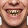 Set di gioielli Grillz a zanna dorata traforata Hip-Hop Transfrontaliero