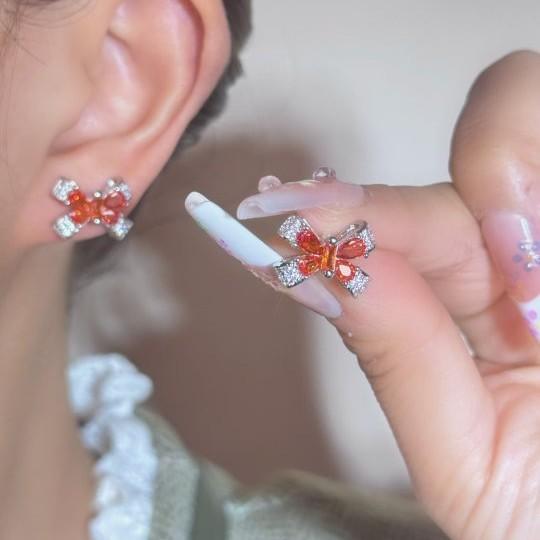 

Sweet cool bright pomegranate red zircon stud earrings women s copper gold-plated micro-inlaid red corundum bow earrings