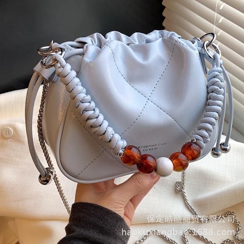This year, the popular small bag women's 2025 new autumn and winter niche design diamond chain shoulder bag texture bucket bag