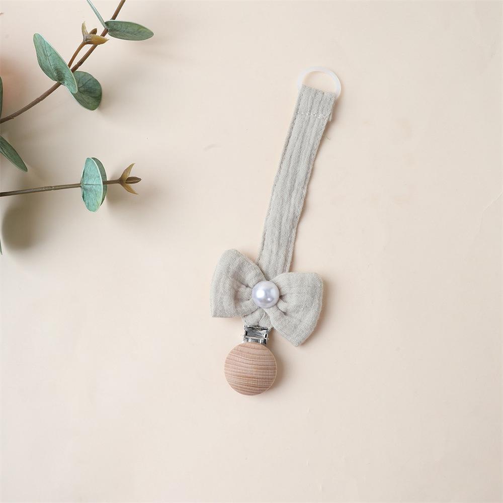 1 Stück Niedlicher Neugeborener Mädchen Schnuller Clip Kette Süße Prinzessin Schleife Schnullerclip Kette Stoff Holz Anti-Verloren Spielzeug Schnullerkette
