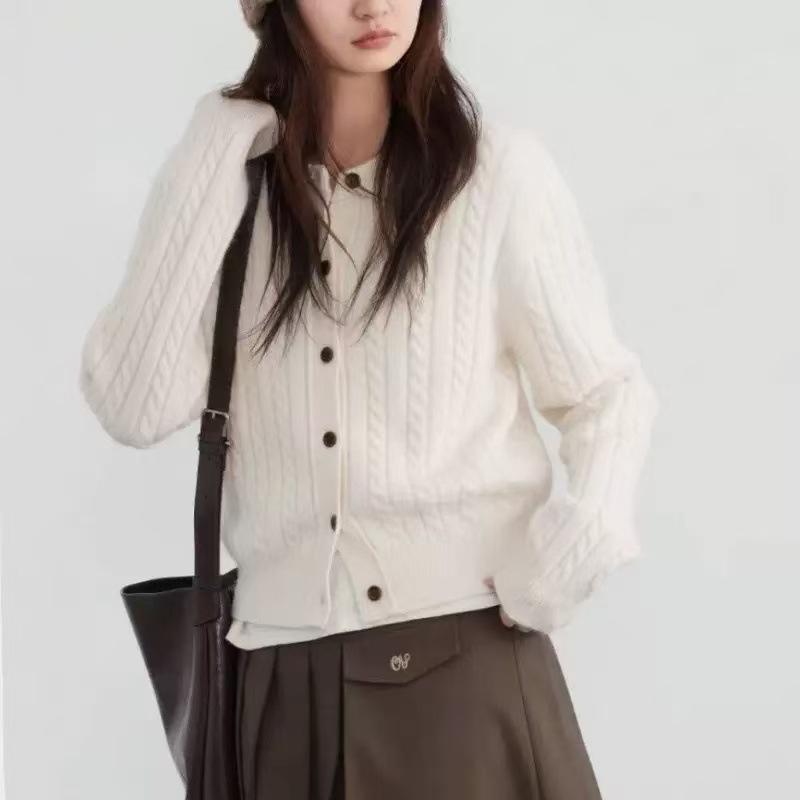 New twist woven single-breasted round neck simple temperament long-sleeved knitted cardigan women's knitted jacket