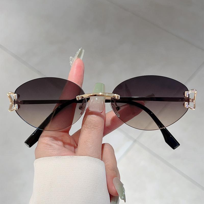 Frameless trimming oval frame fashionable sunglasses, casual versatile trendy sunglasses