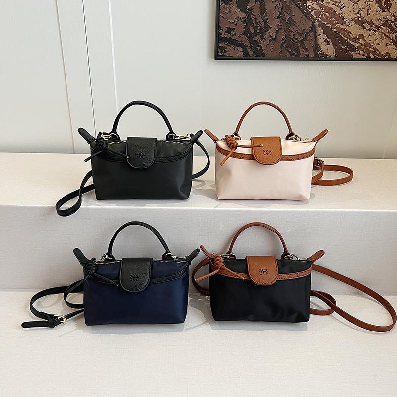 2025 spring new portable casual versatile shoulder messenger Longxiang bag change solid color outdoor bag