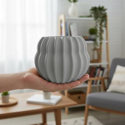 Modern gray barrel-shaped plant pot