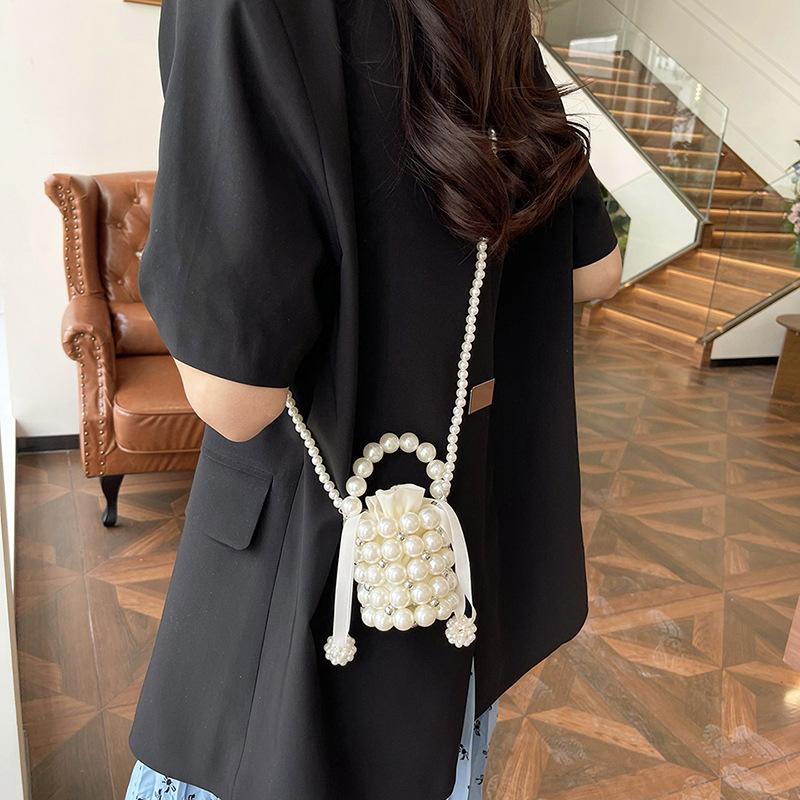 Mori cute imitation pearl woven mini compact women's earphone mouth red envelope spring new shoulder messenger bag
