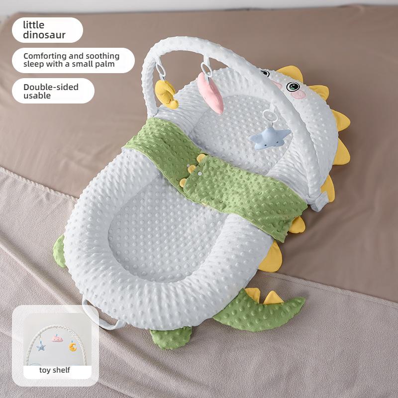 The Newborn Comfort Cradle with a Sloping Pad, Footrest, and Toy Shelf by Little Dinosaur Creates a Cozy and Warm Cradle Bed