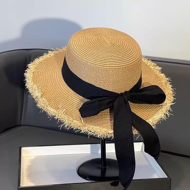 Korean version of bow straw hat women's 2025 big eaves travel versatile straw woven sunscreen visor flat top top hat