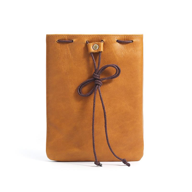 Cowhide Coin Purse: Retro Gift and Auspicious Blessing Bag for Men and Women with Creative Drawstring Design.