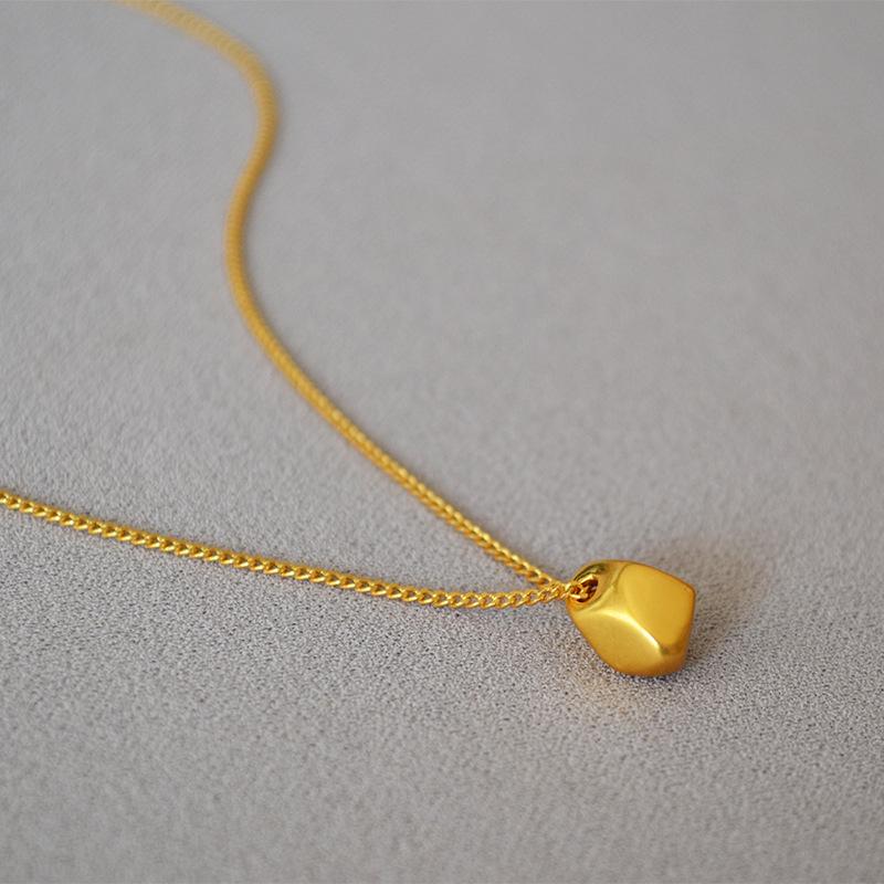 Gold-Plated Brass Pendant Necklace with Irregular Faceted Design - Retro, Versatile, and Stylish.