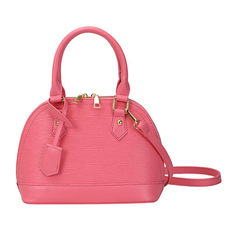 

Женские сумки нишевого дизайна высокой ценности, модные и популярные женские сумки-ракушки, корейские сумки-мессенджеры через плечо большой вместимости. розовый