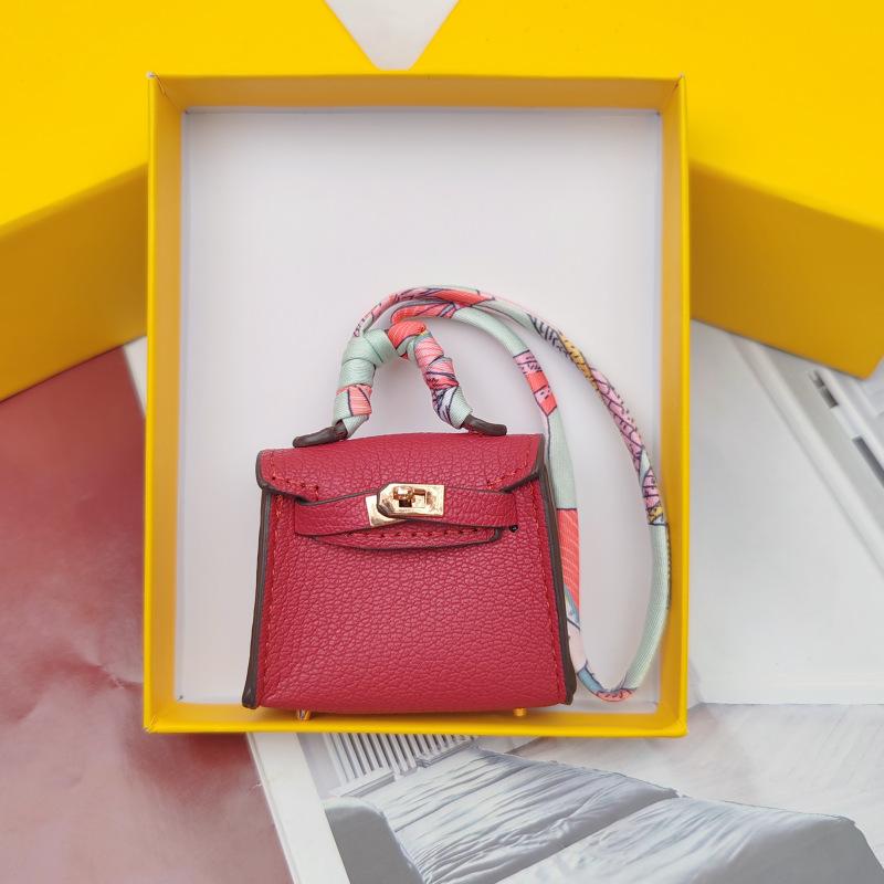 

Hominid-shaped Cute Earphone Case Can Be Hung High-grade Leather Creative Car Key Chain Pendant 6.5x2.5x5cm темно-розовый