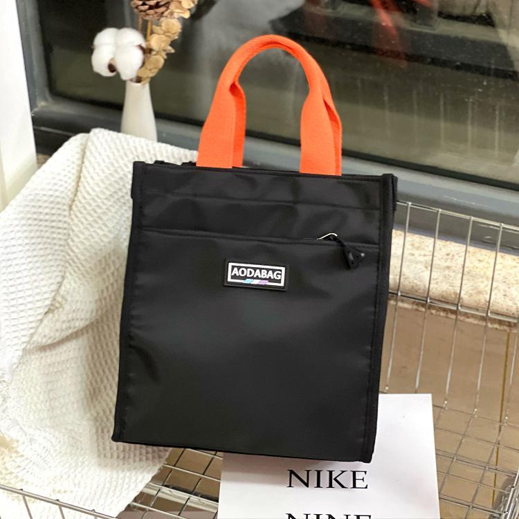 

The new Mori series contrasting color portable lunch box bag, student carrying bento bag at work, make-up bag, file bag, hand carrying mommy