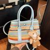 Spring and Summer New Korean Fashion Rainbow Straw Hand-held Bucket Bag Foreign Style Commuting Leisure High Sense Messenger Bag Women