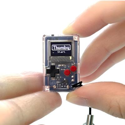 TinyCircuits Thumby, the World's Smallest Mini Game Console, Compatible with Keychains, Programmable, and Features a Clear, Retro Handheld Gamepad. [A