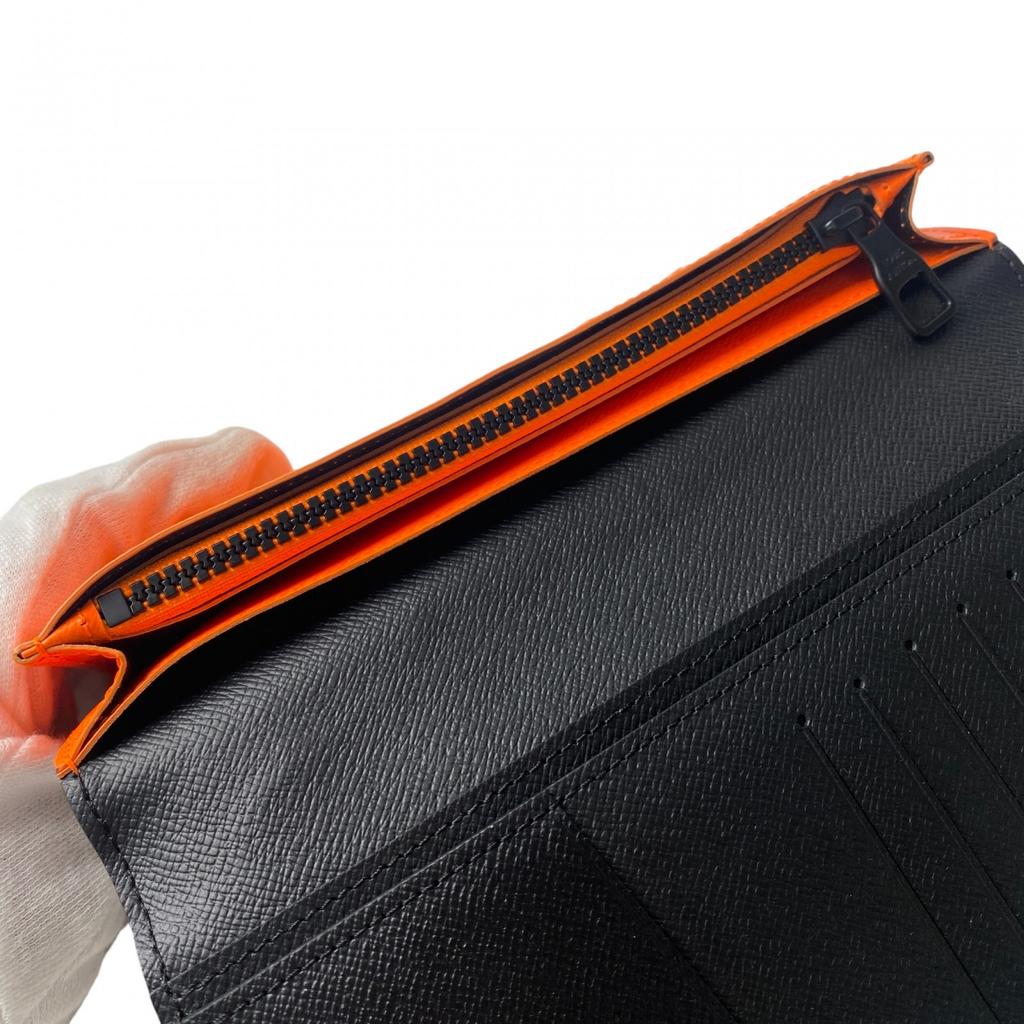 Używany portfel LOUIS VUITTON Seria Brązowo/Pomarańczowa PVC męski