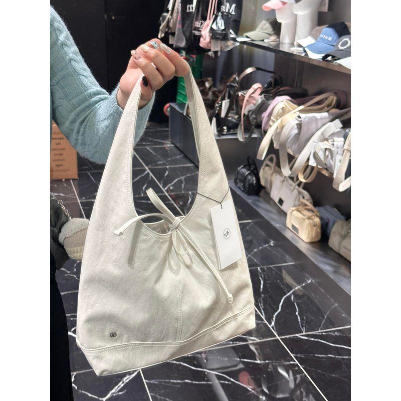 

South korea Niche Depound Bag 2025 New French style Bow Bandage Design Bag Large Capacity All-Match Shoulder Bag Women White Small Size