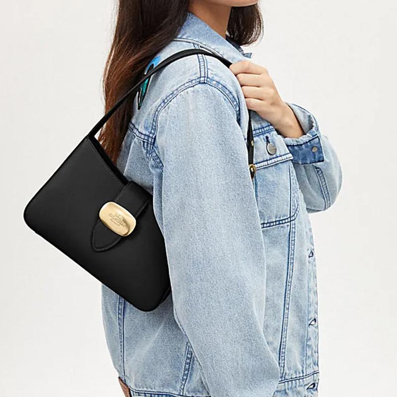 Coach Eliza 25 tinta unita tracolla non rimovibile fessura pelle di mucca borsa a spalla media da donna nera