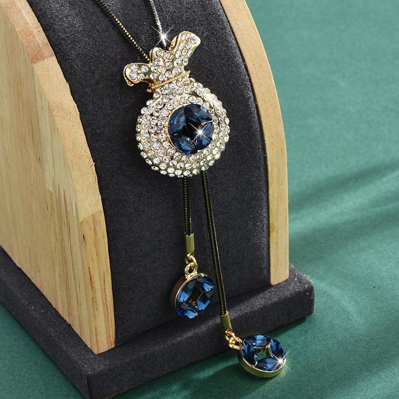 

Fall Unique And Winter Style Long Necklace With Dazzling Money Pouch Crown Design And Snake Chain
