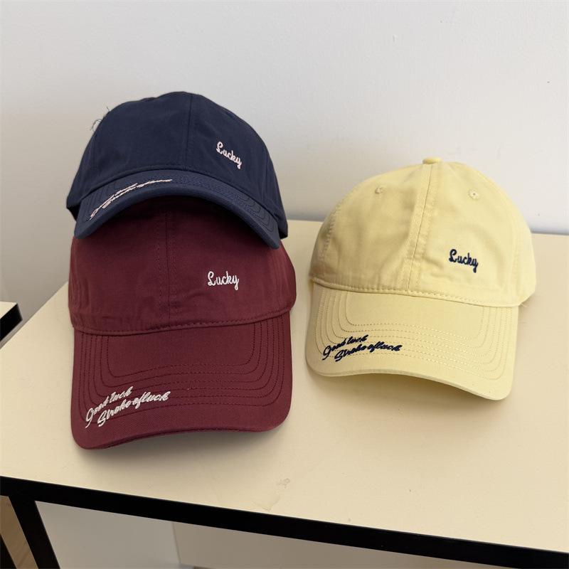 Simple small letter embroidered baseball cap women's spring and summer travel wide brim sunshade versatile face small cap