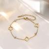 18K Gold Four-Leaf Clover Jewelry Set: Necklace, Bracelet, and Earrings in Titanium Steel with Zirconia.