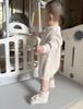 Baby-Strick-Strampler aus Baumwolle - Punktmuster für Herbst/Winter
