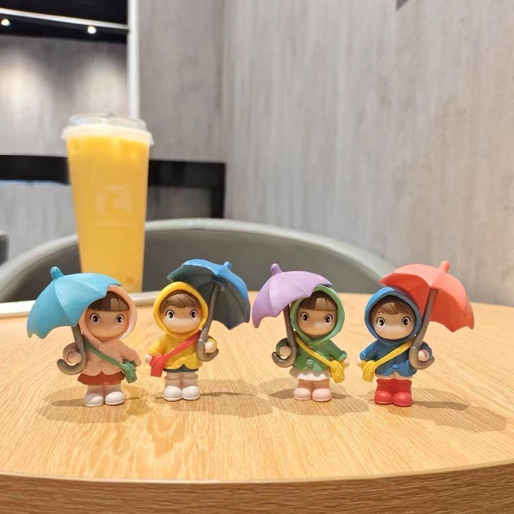 Cartoon Character Desk Ornament: Cute Umbrella-Holding Figure for Creative Office Decor