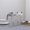 Automatic Open/Close Glass Oil Dispenser: Dustproof, Leakproof, Transparent Oil & Vinegar Bottle with Lid.