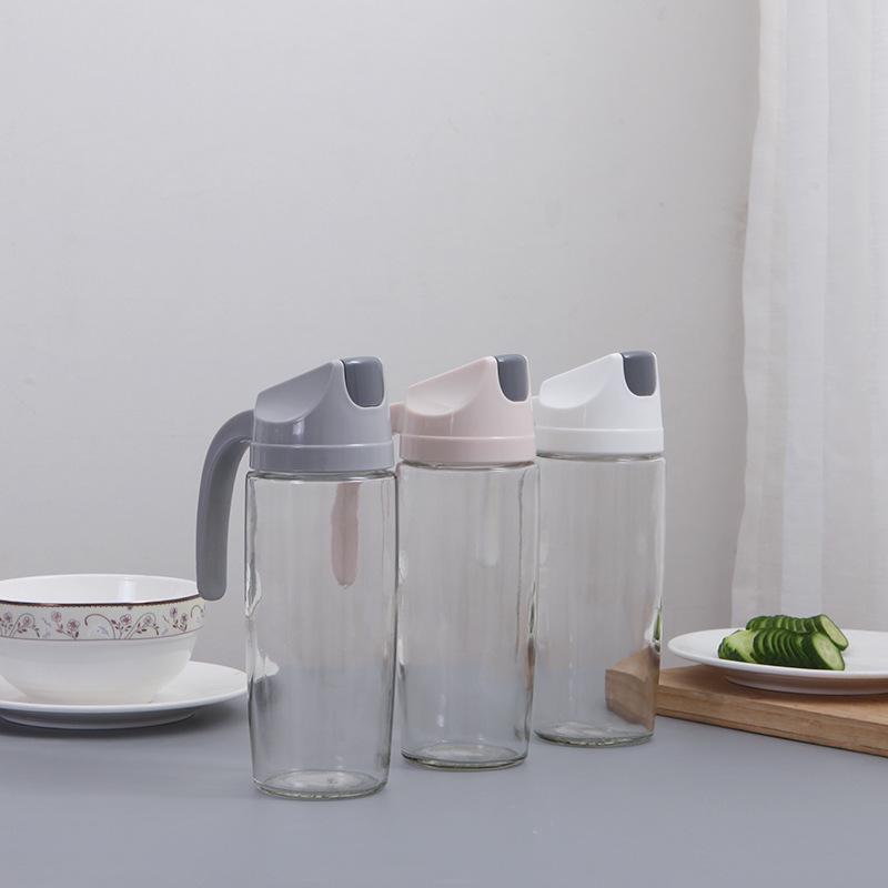 Automatic Open/Close Glass Oil Dispenser: Dustproof, Leakproof, Transparent Oil & Vinegar Bottle with Lid.
