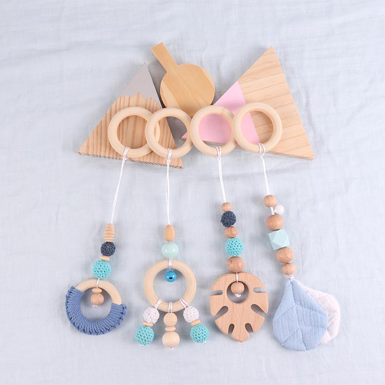 China Manufacturer Exquisite Color Leaf Four-piece Fitness Rack Pendant Wooden Baby Play Activity Gym