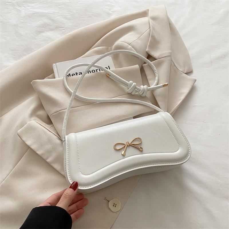 Korean version bow indentation 2025 new trendy fashion solid color design casual messenger portable small square bag women