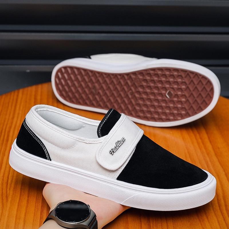 Fashion breathable versatile black and white color matching one-pedal Velcro low-top men's shoes student canvas board shoes