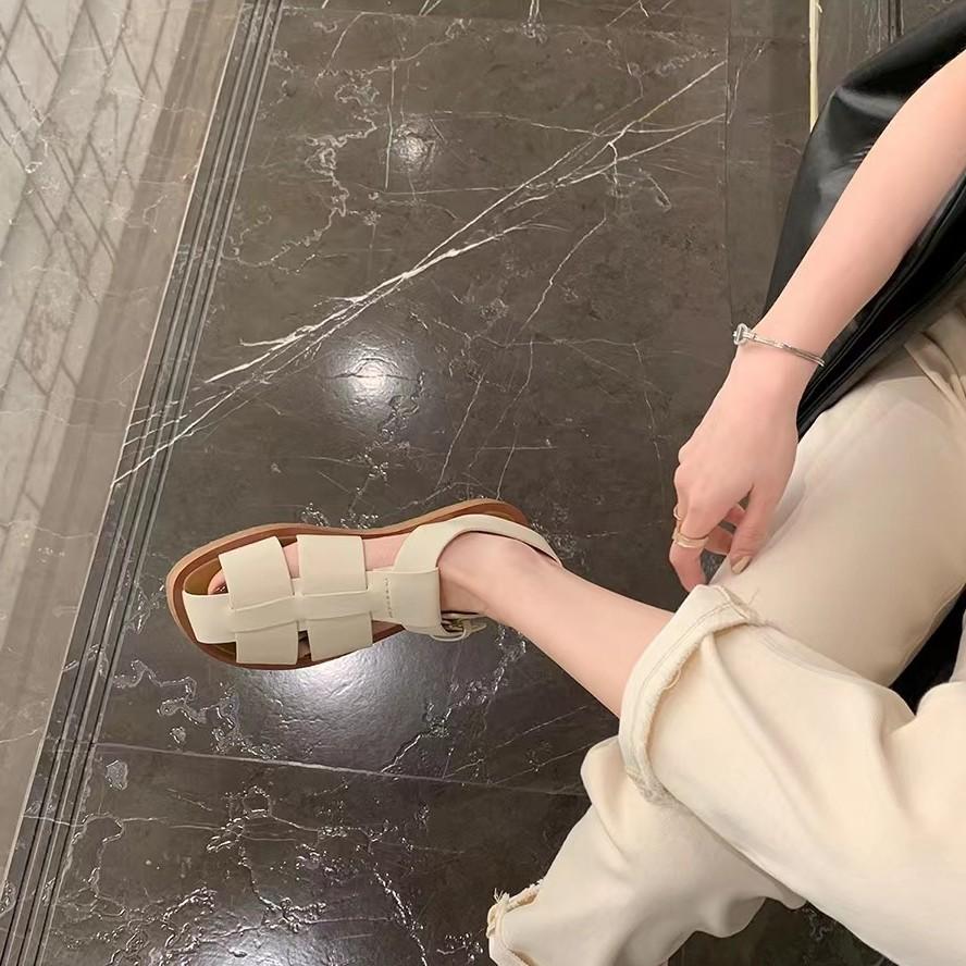 Sheepskin version~ thick-soled woven sandals women's summer one-word buckle belt hollow breathable pig cage shoes flat Roman shoes