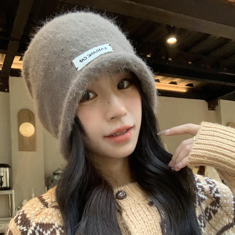 Herbst und Winter neue Stapelmützen Kinder lockeres Gesicht kleine Baotou-Mütze Ohrenschützer kalte Mütze flauschige warme Überziehmütze