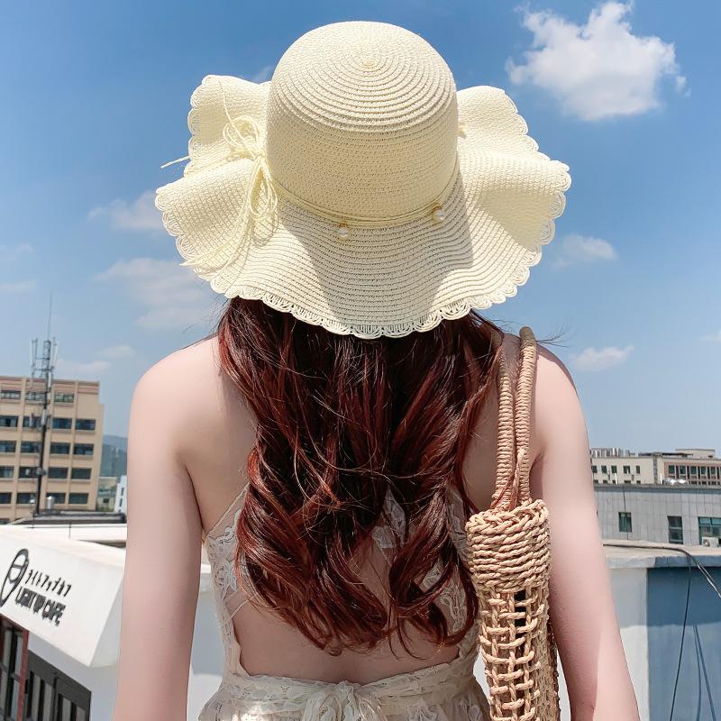 Straw hat women's small fresh and versatile pearl tether bow hat women's summer outing big eaves beach sun hat
