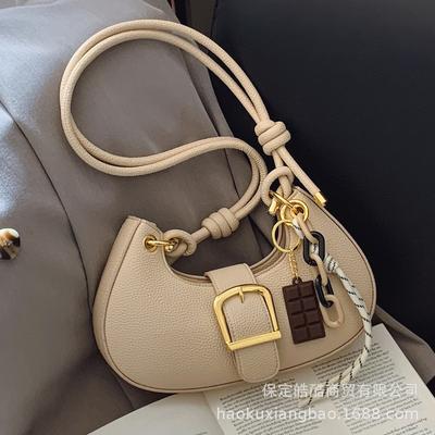 Bolsa feminina de estilo estrangeiro com senso premium 2025 nova bolsa versátil de nicho com alça única para ombro e axila bolsa de bolinho primavera e verão