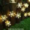 Snowflake Solar LED Fairy String Lights - Waterproof Outdoor Christmas Decoration for Garden, Courtyard, and Balcony.